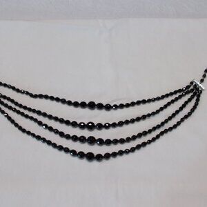 Vintage four strands black glass beads made in Western Germany